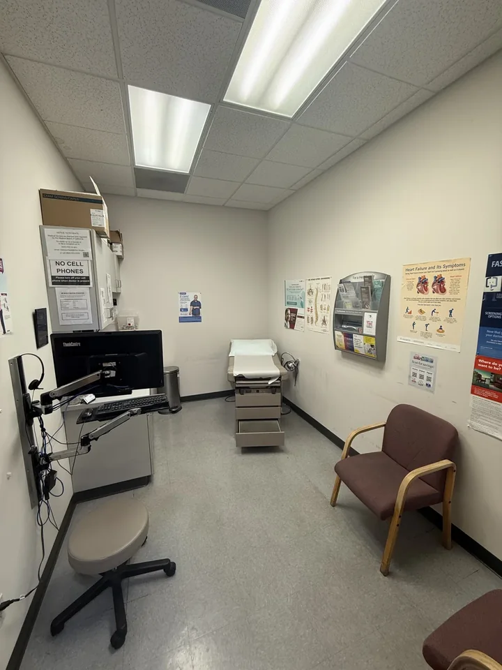 Exam room with examination table and guest seating